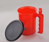 Paint cup with brush holder on the handle